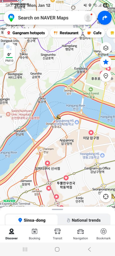 Naver Map app interface showing a detailed map of Seoul with quick search buttons for restaurants and cafes at the top and a discovery menu at the bottom.