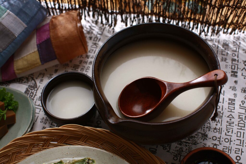 Traditional Korean makgeolli rice wine served in a bowl after hiking in Seoul